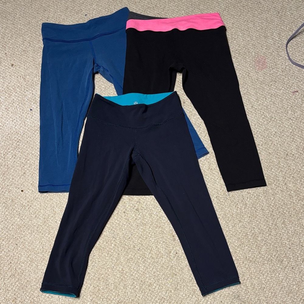 Lululemon athletica Women's Capris - set of 3 Blue, Black, and Pink.  Like new.
